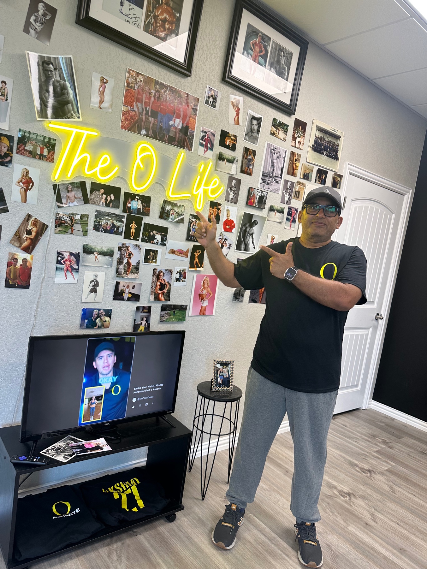 Sriram in front of the O Life legacy wall